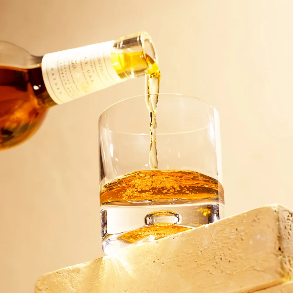 Pouring Basil Hayden® Kentucky Straight Bourbon Whiskey in glass