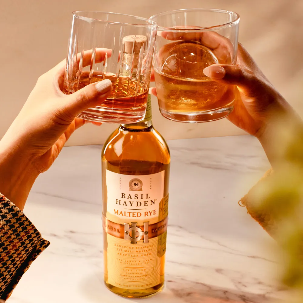 People cheers with Basil Hayden® Malted Rye Kentucky Straight Rye Malt Whiskey