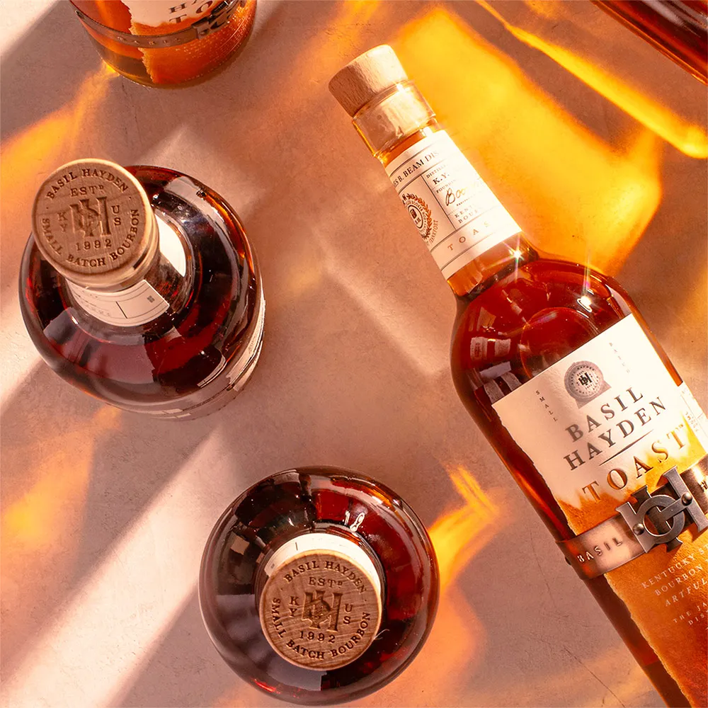 Basil Hayden® Toast bottles on a table