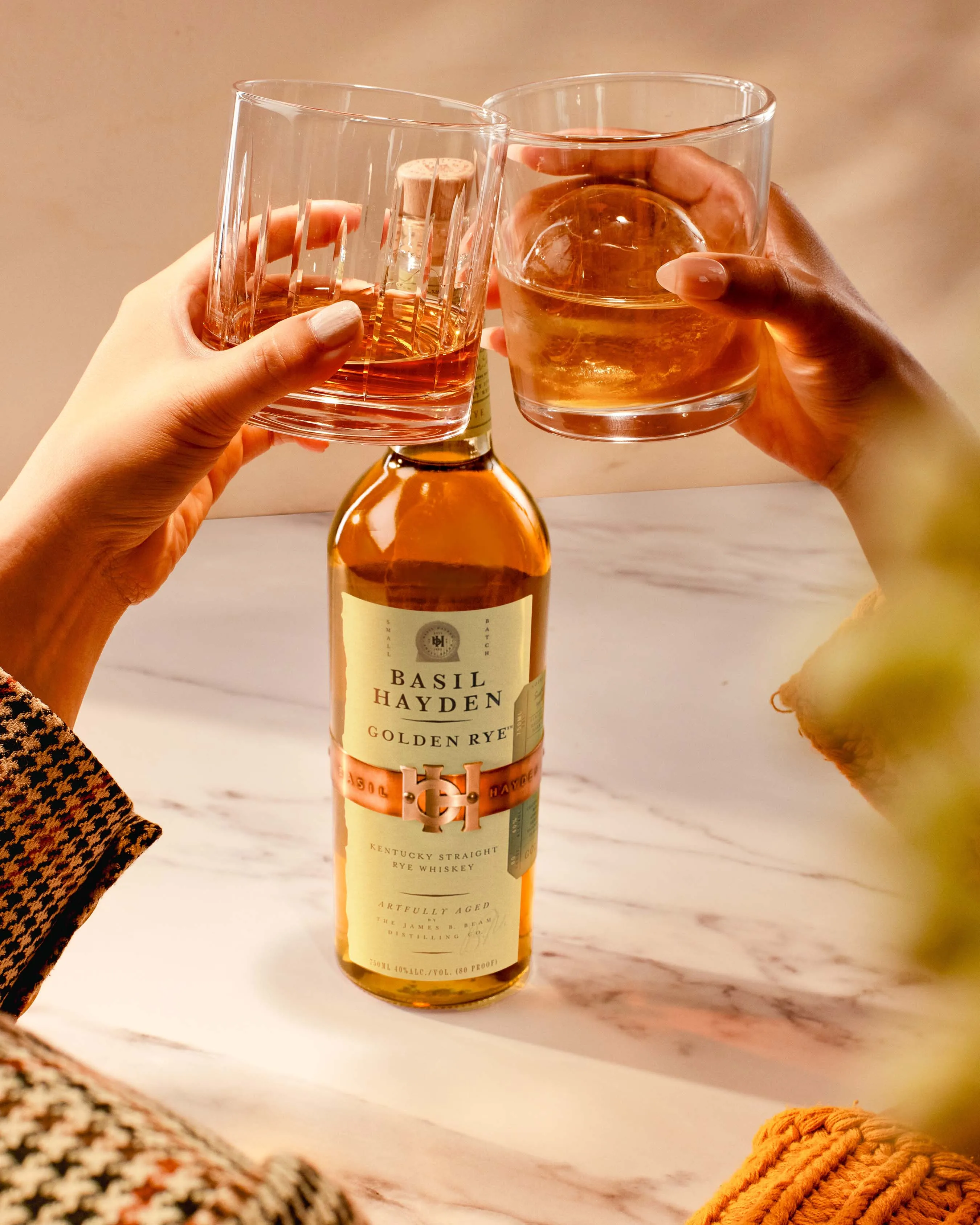 BH Golden Rye Whiskey Cocktail Glasses Cheersing With Bottle In Frame